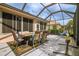 Spacious screened patio with seating and a hammock at 8655 Sw 86Th Cir, Ocala, FL 34481