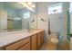 Clean bathroom with tiled floors and a large vanity at 8655 Sw 86Th Cir, Ocala, FL 34481
