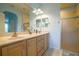 Bathroom with double vanity and large mirror at 8655 Sw 86Th Cir, Ocala, FL 34481