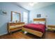 Cozy bedroom featuring a wood bed frame and dresser at 8655 Sw 86Th Cir, Ocala, FL 34481