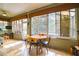 Sunroom with table and chairs, offering backyard access at 8655 Sw 86Th Cir, Ocala, FL 34481