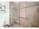 Walk-in shower with glass enclosure and grab bars at 1640 Ne 40Th Ave # 209, Ocala, FL 34470