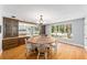 Dining room with hardwood floors, round wooden table, and built-in hutch at 2305 Se 8Th St, Ocala, FL 34471