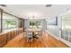 Bright dining room with hardwood floors, round wooden table, and built-in hutch at 2305 Se 8Th St, Ocala, FL 34471