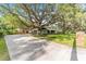 Long driveway leading to a mid-century modern home at 2305 Se 8Th St, Ocala, FL 34471