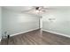 Spacious bedroom with wood-look floors and ceiling fan at 2305 Se 8Th St, Ocala, FL 34471
