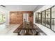 Rustic breakfast nook with farmhouse table and bench seating near kitchen at 2305 Se 8Th St, Ocala, FL 34471