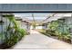 Courtyard with brick and concrete flooring, lush landscaping, and a water feature at 2305 Se 8Th St, Ocala, FL 34471