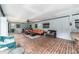 Covered patio with seating area and brick flooring at 2305 Se 8Th St, Ocala, FL 34471