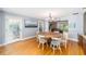 Dining area with hardwood floors, round table, and access to pool area at 2305 Se 8Th St, Ocala, FL 34471