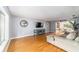 Spacious living room with hardwood floors, neutral walls and a comfy sectional sofa at 2305 Se 8Th St, Ocala, FL 34471
