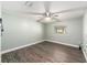 Light and airy bedroom with wood-look floors and ceiling fan at 2305 Se 8Th St, Ocala, FL 34471
