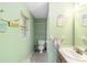 Small bathroom with a toilet and vanity at 2305 Se 8Th St, Ocala, FL 34471