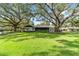 Front yard view of a mid-century modern home at 2305 Se 8Th St, Ocala, FL 34471