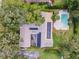 Aerial view of house with pool and solar panels at 2305 Se 8Th St, Ocala, FL 34471
