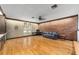 Bright Gathering room features hardwood floors, built-in shelving, and a brick accent wall at 2305 Se 8Th St, Ocala, FL 34471