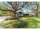 Mid-century modern home with large oak trees at 2305 Se 8Th St, Ocala, FL 34471