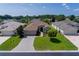 Single-Gathering home with a well-manicured lawn and paver driveway at 15890 Sw 11Th Terrace Rd, Ocala, FL 34473