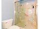 Large walk-in shower with glass enclosure and marble tile at 15890 Sw 11Th Terrace Rd, Ocala, FL 34473
