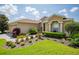 One-story house with a two-car garage and a well-manicured front yard at 15890 Sw 11Th Terrace Rd, Ocala, FL 34473