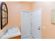 Convenient laundry room with sink, built-in cabinets and access to kitchen at 15890 Sw 11Th Terrace Rd, Ocala, FL 34473