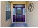 Purple front door with sidelights and a wreath at 15890 Sw 11Th Terrace Rd, Ocala, FL 34473