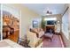 Bright sunroom with seating area and view into the kitchen at 15890 Sw 11Th Terrace Rd, Ocala, FL 34473