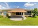 Spacious backyard with patio and retractable awning at 15890 Sw 11Th Terrace Rd, Ocala, FL 34473