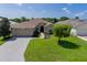 Single-Gathering home with landscaped yard and paver driveway at 15890 Sw 11Th Terrace Rd, Ocala, FL 34473