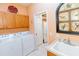 Laundry room with washer, dryer, and additional storage cabinets at 15890 Sw 11Th Terrace Rd, Ocala, FL 34473