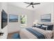 Virtually staged bedroom with window and wood-look floors at 5 Emerald Trl, Ocala, FL 34472