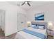 Virtually staged bedroom with double doors and wood-look floors at 5 Emerald Trl, Ocala, FL 34472