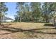 Large backyard with mature trees at 5 Emerald Trl, Ocala, FL 34472