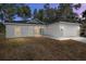Two-bedroom home with a two-car garage and landscaping at 5 Emerald Trl, Ocala, FL 34472