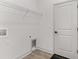 Laundry room with shelving and a pet door at 5 Emerald Trl, Ocala, FL 34472