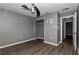 Bedroom with gray walls, wood-look flooring, and a closet at 49 Fisher Way, Ocklawaha, FL 32179