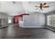 Open living space with gray walls and dark gray flooring at 49 Fisher Way, Ocklawaha, FL 32179