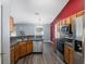 Kitchen with wood cabinets and stainless steel appliances at 49 Fisher Way, Ocklawaha, FL 32179