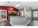 Kitchen features wood cabinets, stainless steel appliances, and a breakfast bar at 49 Fisher Way, Ocklawaha, FL 32179