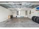Garage with open overhead door, and storage shelving at 49 Fisher Way, Ocklawaha, FL 32179