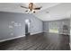 Bright living room with gray walls and dark flooring at 49 Fisher Way, Ocklawaha, FL 32179