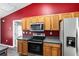 Updated kitchen featuring wood cabinets and a stainless steel range at 49 Fisher Way, Ocklawaha, FL 32179