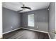 Simple bedroom with grey walls and laminate flooring at 49 Fisher Way, Ocklawaha, FL 32179