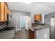 Kitchen with gray countertops and stainless steel appliances at 49 Fisher Way, Ocklawaha, FL 32179