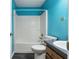 Clean bathroom with a bathtub, toilet and sink at 49 Fisher Way, Ocklawaha, FL 32179