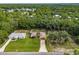 Aerial view showing home with large backyard and neighboring properties at 49 Fisher Way, Ocklawaha, FL 32179