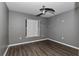 Simple bedroom with gray walls and wood-look flooring at 49 Fisher Way, Ocklawaha, FL 32179