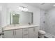Bathroom boasts double vanity, marble shower, and modern fixtures at 1 Pine Trace Trl, Ocala, FL 34472