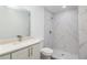 Clean bathroom with white vanity, marble shower, and modern toilet at 1 Pine Trace Trl, Ocala, FL 34472