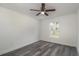 Spacious bedroom with large window and ceiling fan at 1 Pine Trace Trl, Ocala, FL 34472